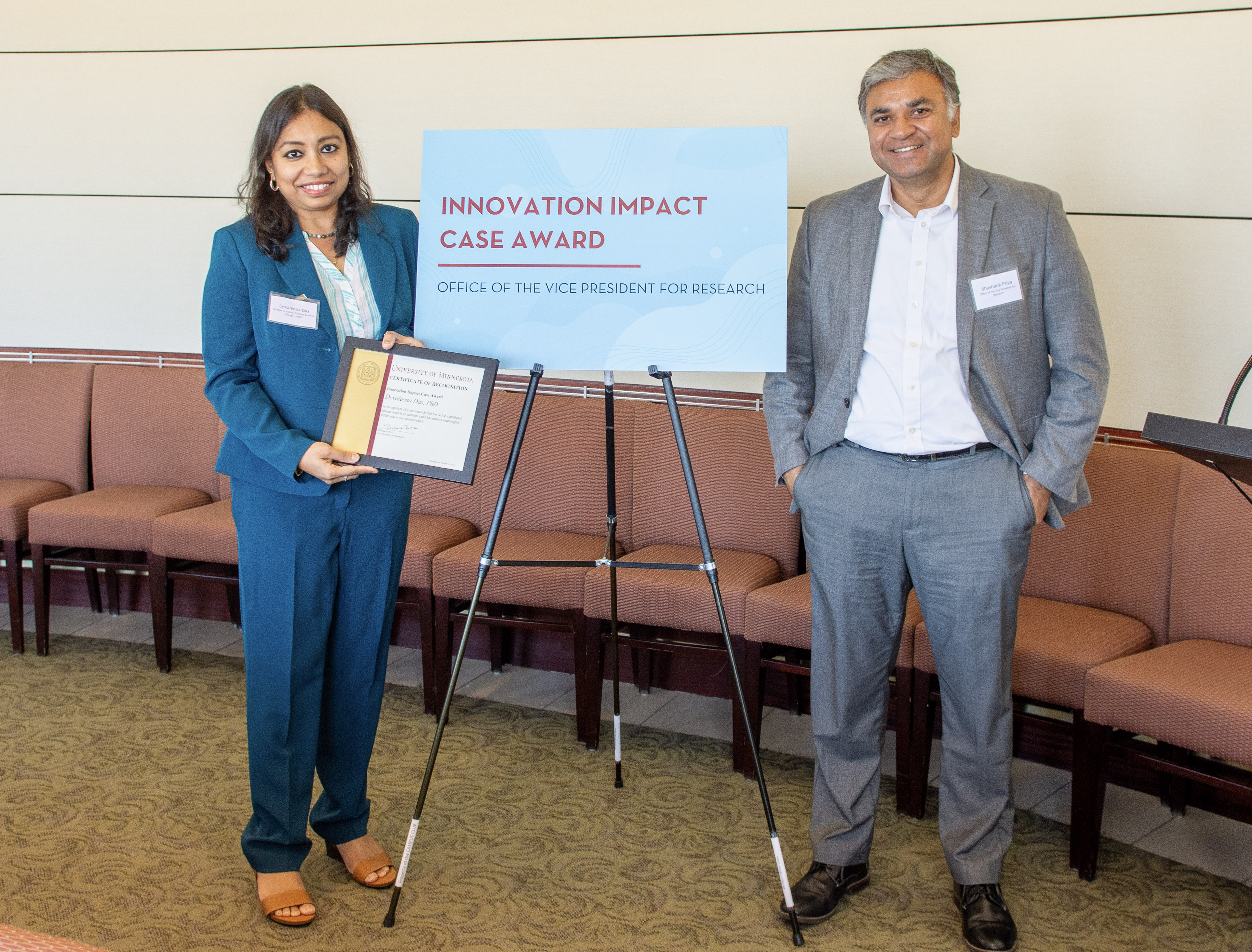 Photo of Dr. Devaleena Das receiving her award