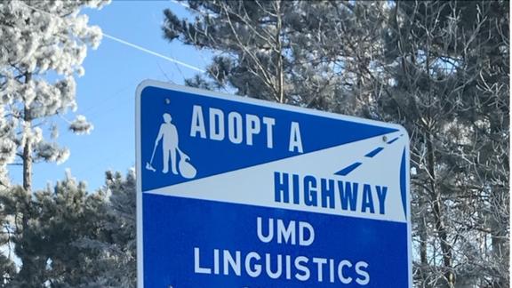 Adopt a highway sign displaying 'UMD Linguistics' as sponsor
